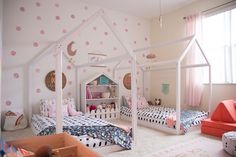 an instagram page with two twin beds and pink polka dot wallpaper on the walls