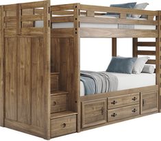 a bunk bed with drawers underneath it and a white pillow on the bottom one side