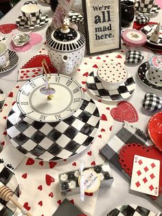 a table topped with lots of plates covered in hearts