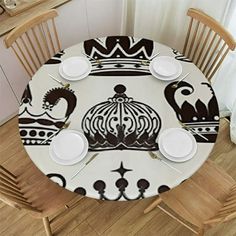 the table is set with white plates and place settings for four people to eat at