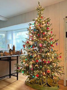 a decorated christmas tree in a living room