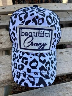 How cute are these beautiful crazy cheetah print hats?! Gotta love the ponytail cut out in the back to rock the messy bun! Casual Adjustable Leopard Print Hat, Trendy Leopard Print Cap, Hat With Ponytail, Black And White Cheetah Print, White Cheetah Print, Beautiful Crazy, Custom Purses, Western Accessories, Distressed Hat