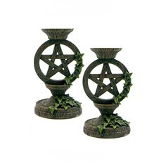 two decorative candlesticks with an inverted pentagram