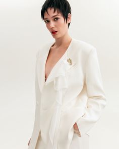 Timeless wardrobe staples – where impeccable fit meets sophisticated tailoring. The white boyfriend blazer is crafted from suit fabric to an oversized silhouette, featuring lapels, pockets, and a hidden single-breasted peak. With a structured shoulder and boxy silhouette, the style can effortlessly transition from day to night. For a completely stylish look pair your pants, dress, or skirt with a white boyfriend blazer. Details: Material: Suit fabric Fabric composition: 39% cotton, 70% polyester Chic Office Blazer With Structured Boning, Chic Single-breasted Tuxedo With Lapel Collar, Chic Single Breasted Tuxedo With Lapel Collar, Chic Notch Lapel Tuxedo With Pressed Crease, Chic Tailored Tuxedo With Lapel Collar, Chic Single-breasted Wedding Blazer, Chic Tuxedo With Notch Lapel And Pressed Crease, Chic Tailored Tuxedo With Hidden Button Closure, Chic Semi-formal Tuxedo