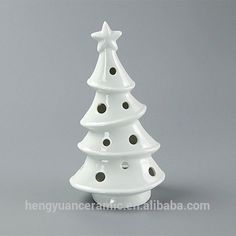 a white ceramic christmas tree on a gray background