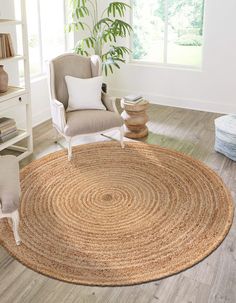 a living room with a chair and rug