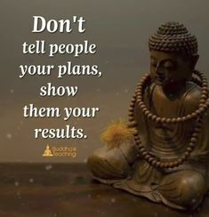 a buddha statue sitting on top of a wooden table next to a quote that says don't tell people your plans, show them your results