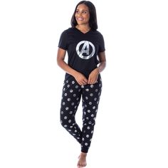 This is an OFFICIALLY LICENSED Marvel Comics Avengers pajama set!! If you're a fan of Marvel Comics and especially costume style pajamas, you're going to love this Avengers merchandise! Avengers has recently taken the world by storm, and this is your chance to show how much you love the fandom! The shirt top features a silver foil Avengers logo design with a V-neck. The Jogger pajama pants feature the same design in an all over print with cuffed legs, a drawstring that can synch to fit your size Black Graphic Print Sleepwear For Loungewear, Black Sleepwear With Character Print For Loungewear, Avengers Merchandise, Avengers Logo, Marvel Clothes, Marvel Women, Silver Foil, Shirt Top, Marvel Comics