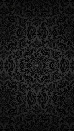 a black wallpaper with an ornate design on it's side, and the background is