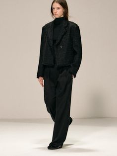 This timeless wool blend tweed jacket features a cropped silhouette with elegant fringe detailing along the seams, making it a versatile wardrobe staple. The structured fabric composition ensures the jacket maintains its shape while offering a comfortable fit with classic details like notched lapels, button cuffs, and side pockets. Perfect for both formal and casual styling, this black jacket can be effortlessly paired with tailored pieces or dressed down with denim for an elevated everyday look Winter Business Cropped Jacket, Cropped Business Jacket For Winter, Business Cropped Jacket For Winter, Elegant Cropped Tweed Outerwear, Tailored Cropped Tweed Jacket For Work, Chic Cropped Tweed Jacket For Work, Cropped Tweed Outerwear For Winter, Tailored Cropped Tweed Jacket For Fall, Cropped Tweed Jacket For Fall Workwear