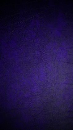 a dark purple leather texture background or wallpaper with space for the text on it