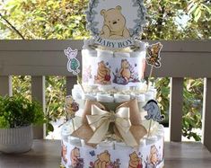 a three tiered winnie the pooh diaper cake