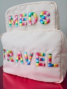 The Meds Medium Bag is the perfect travel companion. With a lightweight nylon construction and zipper closure, it offers superior protection against weather, wear and tear. In addition to its practical benefits, the bright colored rainbow stitching across the bag in an eye-catching design. It pairs perfectly with the RX Mini and Bikini XL, making it the ideal choice for your next trip. Functional Pink Travel Accessories For Weekend Trips, Pink Nylon Bag With Luggage Sleeve, Pink Travel Bag With Zipper Closure For Trip, Pink Nylon Travel Bag For Overnight Trips, Pink Bags With Zipper Closure For Overnight Trips, Pink Nylon Bag For Trip, Pink Nylon Bag For Overnight Trips, Playful Nylon Travel Bags, Packable Nylon Trip Bags