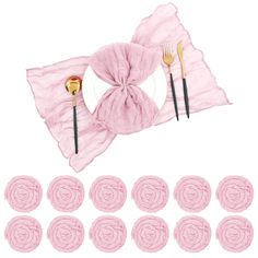 pink napkins with gold forks and spoons on top of each other next to a set of rose - shaped placemats