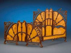 an ornately carved wooden bed frame with intricate carvings