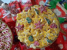 christmas cookies and candies are arranged on the table