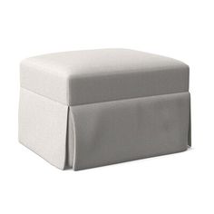 a white foot stool sitting on top of a white floor