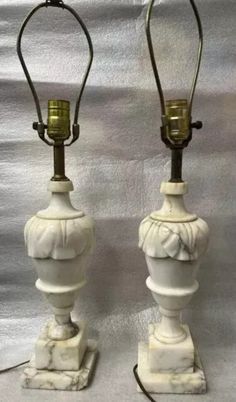 two white marble lamps with brass accents