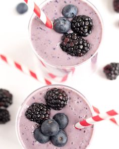 two glasses filled with blueberries and blackberries