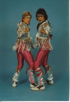 two women dressed in disco outfits with words that say, who's awesome? you're awesome