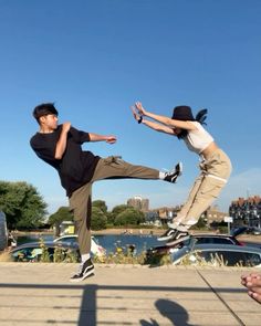 two young men are doing tricks on skateboards