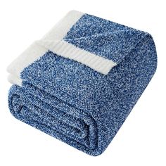 a blue and white blanket folded on top of each other