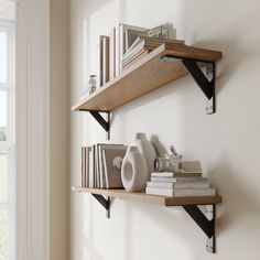 two wooden shelves with books and vases on them