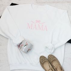 Celebrate your love for motherhood with our Embroidered Mama Sweatshirt with Bow! This sweet sweatshirt features a charming bow detail and is the perfect gift for any mama. Treat yourself or a loved one to this cozy and stylish piece. Own your motherhood journey with our sweatshirt today! We primarily use unisex Jerzee Nublend sweatshirts. matching baby romper here Pre-shrunk 1x1 Ribbed collar, cuffs, and waistband with spandex Double-needle stitched collar ,armholes and waistband. Modern classi Cute Crew Neck Sweatshirt For Mother's Day, White Cotton Sweatshirt For Mother's Day, Casual White Sweatshirt For Mother's Day, Mother's Day Gift Sweatshirt, Casual Sweatshirt As Gift, Cute White Sweatshirt For Mother's Day, Big Bow Headband, Back To School Kids, Headband Outfit