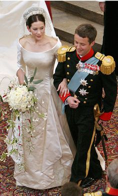 the bride and groom are walking down the aisle at their wedding ceremony in london, england