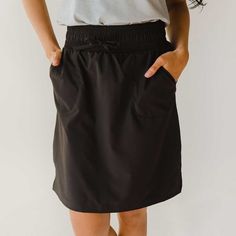 The Away skirt. A casual and comfy women’s skirt that is a staple piece for anyone looking for versatile pieces (that's you right?). Special features like a high 3 inch waistband, pockets at the sides and drawstring cord will keep you feeling fresh no matter where your next adventure may take you. Made out of our light weight, wrinkle free fabric that our Jetsetter and Jumpsuit lovers can't get enough of, it's perfect for travel, work, or just a day out on the town. 90% NYLON - 10% SPANDEX Wash Skirt Outfits Casual, Albion Fit Swim, Albion Fit Swimsuit, Black Skirt Outfits, Albion Fit, Place Dress, Maternity Swimsuit, Swim Coverup, Swim Skirt