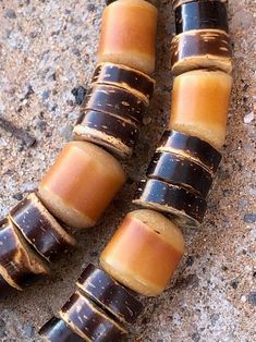 Coconut shell beads African amber beads (resin, we believe) Old silver bench beads, Native 2 strands Limpet shell pendant Secure hook clasp Light but substantial on Unisex Stamp: none, artisan Native made 20210710J1068 Provenance: mid1980s Condition: Excellent vintage condition. No issues of note. See pics. Sold as is. Measurements: Total length 17.25inches (43.81cm) Size of limpet shell itself 2 x 1.5inches (5.08 x 3.81cm) Drop 4.75inches (12.06cm) Check measurements and/or convo with ANY quest Shell Beaded Necklaces For Jewelry Making, Brown Beaded Shell-shaped Jewelry, Brown Polished Beads For Beach, Brown Beaded Shell Jewelry, Vintage Beaded Shell Necklace With Round Beads, Vintage Beaded Shell Necklace, Shell Necklaces With Large Round Beads, Limpet Shell, Amber Bead Necklace