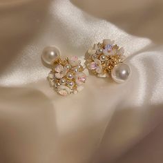 ✦ Indulge in the romance of our elegant stud earrings adorned with a delicate flower pearl design, perfect for adding a touch of grace to your wedding ensemble or elevating your bridesmaid look. Crafted with meticulous detail, these earrings encapsulate the essence of romance, making them an ideal choice for those special occasions. The timeless appeal of the flower pearl design adds a subtle and sophisticated charm, making these earrings a versatile accessory for various elegant events. Whether Red Opal, Front Back Earrings, Ear Jacket Earring, Basic Jewelry, Ear Jacket, Jewelry Style, Red Style, Fashion Jewelry Earrings, Elegant Flowers