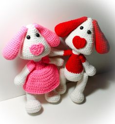 two crocheted stuffed animals sitting next to each other