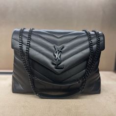 Brand New Bag With Front Flap, Featuring Interlaced Metal Ysl Initials, A Leather And Metal Chain Strap That Can Be Worn Doubled On The Shoulder And Y-Quilted Overstitching. 100% Calfskin Leather Dimensions: 32 X 22 X 12 Cm / 12.6 X 8.7 X 4.7 Inches Strap Drop: Doubled 26 Cm / 10.2 Inches, Single 48 Cm / 18.9 Inches Black-Toned Metal Hardware Magnetic Snap Closure Interior: Two Main Compartments Separated By A Zip Pocket, One Zip Pocket Grosgrain Lining Style Id 574946dv7281000 Made In Italy All Black Ysl Bag, Ysl Chain Bag, Black Purse Designer, Ysl Black Bag, Black Ysl Bag, Ysl Shoulder Bag, Ysl Purse, Ysl Handbags, Noir Color