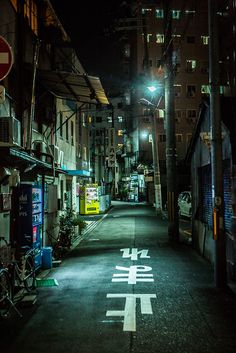 an empty city street at night with no cars