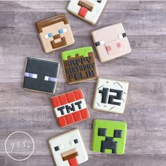 some cookies that are decorated to look like minecrafts and the words happy birthday feltie on them