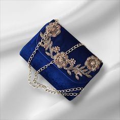 👛 Blue Clutch with beautiful thread and sequins embroidery. The intricate multi- colored embroidery on the gold clutch is a work of art, featuring delicate floral patterns that will be sure to turn heads wherever you go. This clutch is ideal for carrying your phone, keys, makeup, or other small items. Size :  ✅ FEATURES: ⦿ Comes with top handle and sling chain ⦿ Made using high-quality material ⦿ A must-have accessory ⦿ Feels glamorous to the touch  ⦿ beautiful and detailed works ✅ SPECIFICATIONS: ⦿ Item Type: Embroidered Purse ⦿ Material: Sequins, Zardozi, Etc. ⦿ Gender: Women ⦿ Item Made; Handmade Whether you are dressing up for a wedding, dinner party or a night out with friends, this blue embroidered clutch is the perfect accessory to complete your look. Its generous size makes it con Royal Blue Purse, Embellished Purses, Navy Purse, Elegant Clutch, Embroidered Purse, Blue Clutch, Embroidered Clutch, Gold Clutch, Wedding Purse