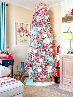 a red and white christmas tree in a living room