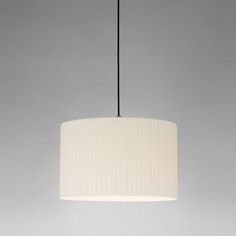 a white lamp hanging from a ceiling with a black cord on the top and bottom