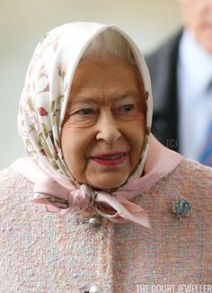 the queen of england is wearing a headscarf