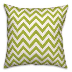 a green and white chevroned pillow