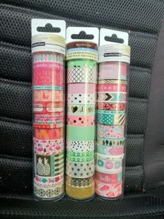 three rolls of washi tape sitting on top of a seat