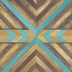 an abstract painting with blue, brown and gold colors on it's surface is shown