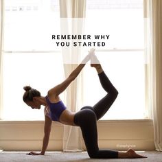 a woman doing yoga in front of a window