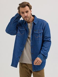 Made for cold-weather layering, our Men’s Sherpa-Lined Denim Shirt Jacket will quickly become your secret weapon. It comes with a 100% cotton denim exterior in a medium blue wash, with a soft sherpa lining through the body and quilted taffeta through the sleeves to keep you warm. This heavyweight shirt jacket has large side pockets and chest flap pockets with the signature “W” embroidery for an authentic Wrangler® feel. Plus, its relaxed fit is perfect for layering. Rugged Long Sleeve Denim Jacket For Outdoor, Winter Denim Blue Shacket, Wrangler Denim Shirt, Denim Shirt Outfit, Denim Shirt Jacket, Shirt Flannel, Shirt Jacket Men, Mens Sherpa, Wrangler Shirts