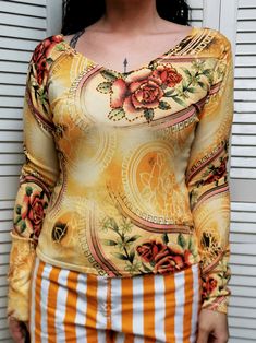 Vintage 90s yellow roses print long sleeve top Top is in great vintage condition. SIZE. The model usually wears UK 10-12, top could fit UK 10-12 / S-M. Please, check the measurements before buying. MEASUREMENTS. Fabric is stretch. Bust - 82 cm, length - 54 cm. Item is made from 70% viscose, 25% cotton, 5% elastan. Color may differ slightly depending on the color calibration of the device you're viewing on. If You have more questions about products or shipping, please drop me a message. Wish You Yellow Long Sleeve Printed Top, Long Sleeve Tops With Rose Print For Spring, Long Sleeve Top With Rose Print For Spring, Retro Yellow Long Sleeve Tops, Retro Long Sleeve Yellow Tops, Luxury Room, Roses Print, Cotton Jumper, Womens Sweaters