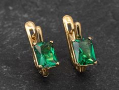 Gold Emerald Earrings set with Created Emerald in an octagon diamond cut, flawless clarity & deep green color, at size 8x6mm each, 4 Carats a pair. Gold Emerald Cut Earrings design made of Gold Vermeil: Thickest 3 Micron Gold plate on Solid 925 Sterling Silver.Click here for ☞ Matching RingClick here for ☞ Matching Pendant Details:♥ Created Emerald in a flawless clarity♥ Emerald: 8x6mm, 4 Ct a pair, diamond cut♥ Lever Back Closure - "English Lock"♥ Length 13mm, Width 6mm♥ Solid 925 Sterling Silv Gold Emerald Earrings, Deep Green Color, Earrings Square, Cute Gift Boxes, Real Jewelry, Emerald Earrings, Matching Rings, Princess Diamond, Green Earrings