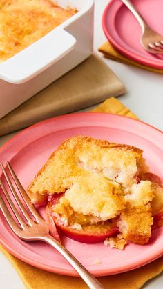 a pink plate topped with an apple pie next to a fork and bowl of food