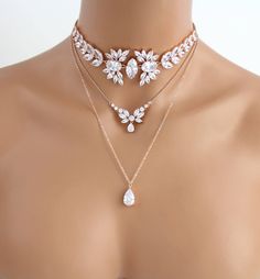 Amazing Stemenet rose gold layered necklace created with large stones for a dramatic style. Created with Swarovski Pure Brilliance stones for stunning sparkle like real diamonds. Avaialbe in 3 finished, rose gold, rhodium or yellow gold finish. Necklace choker part measures 13 inches in photos. Extends to 15 inches. Longest part measures 19 inches. Matching bracelet: https://www.etsy.com/listing/475583792/rose-gold-bracelet-bridal-bracelet?ref=shop_home_feat_4 Suggested earrings: https://www.ets Rose Gold Layered Necklace, Rose Gold Choker Necklace, Kalung Choker, Rose Gold Choker, Gold Layered Necklace, Necklace Bridal, Gold Necklace Layered, Fantasy Jewelry, Diy Schmuck