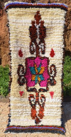 an old rug is sitting on the ground